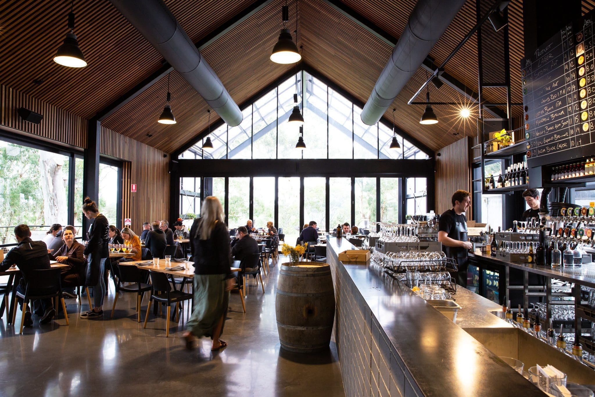 A busy bar and dining room at Lot 100