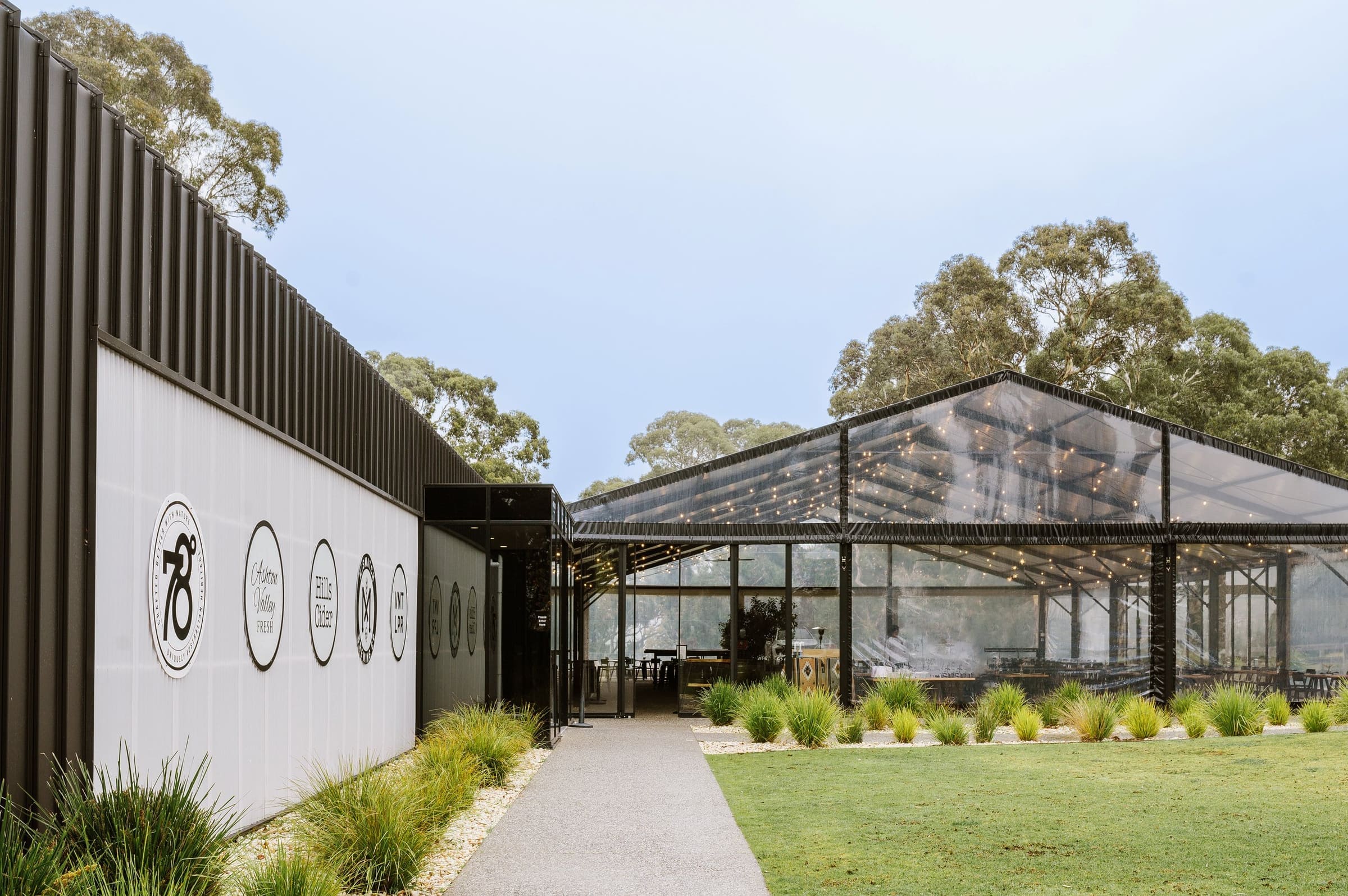 Venue entrance and lawn among gum trees