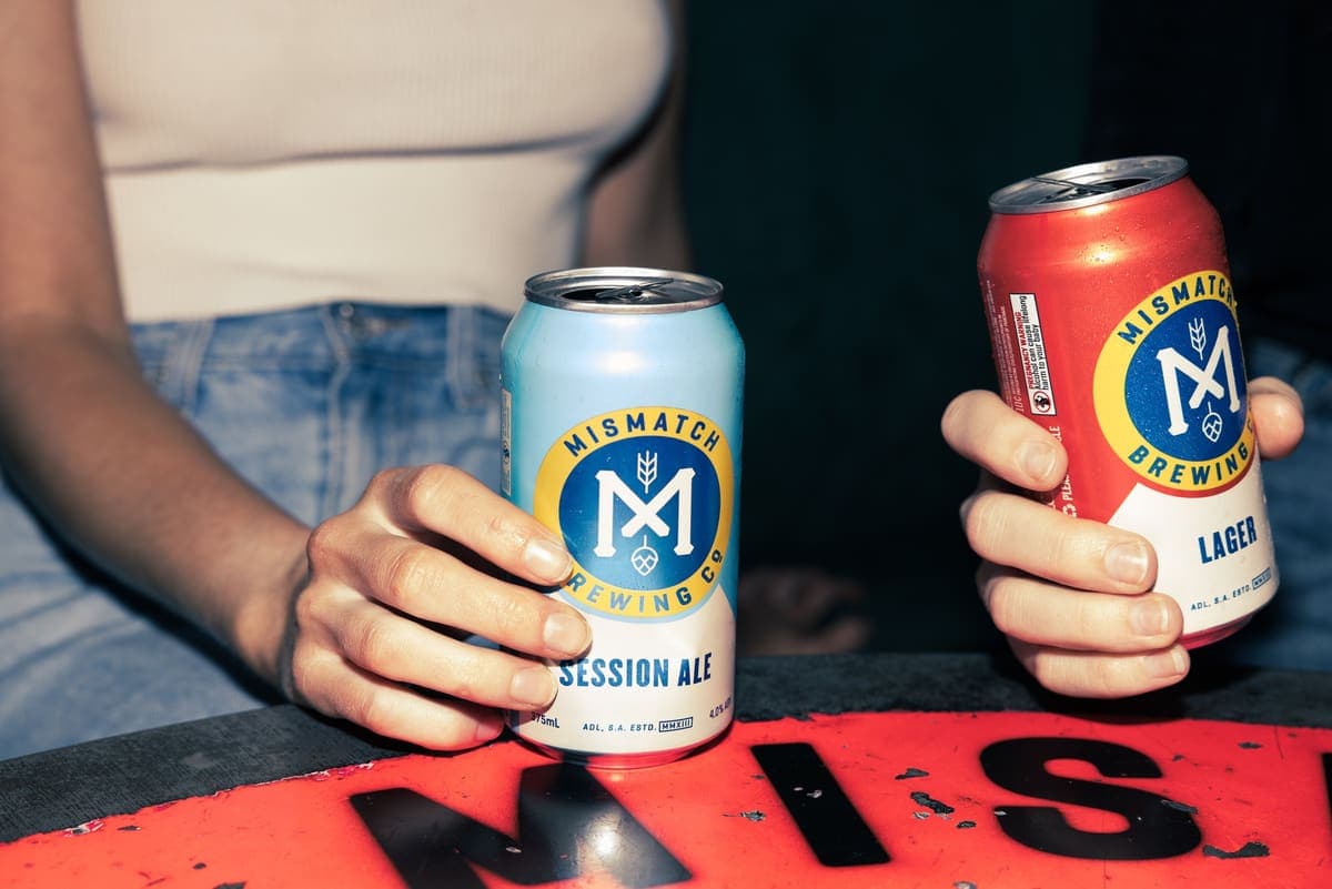 Mismatch Session Ale and Lager cans on the bar
